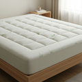 Bamboo fibre cooling mattress pad on a mattress