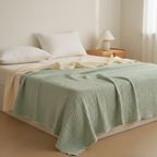Six-layer cotton gauze blanket draped over a bed